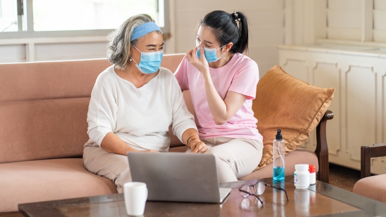 Older_and_younger_women_in_masks_managing_medications