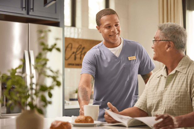 Senior care staff member with elder person