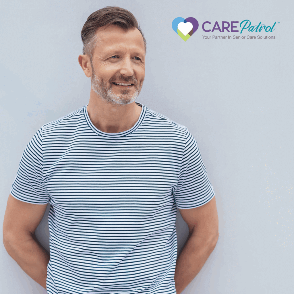 Middle aged man against a wall