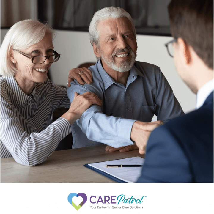 Elderly couple with business person